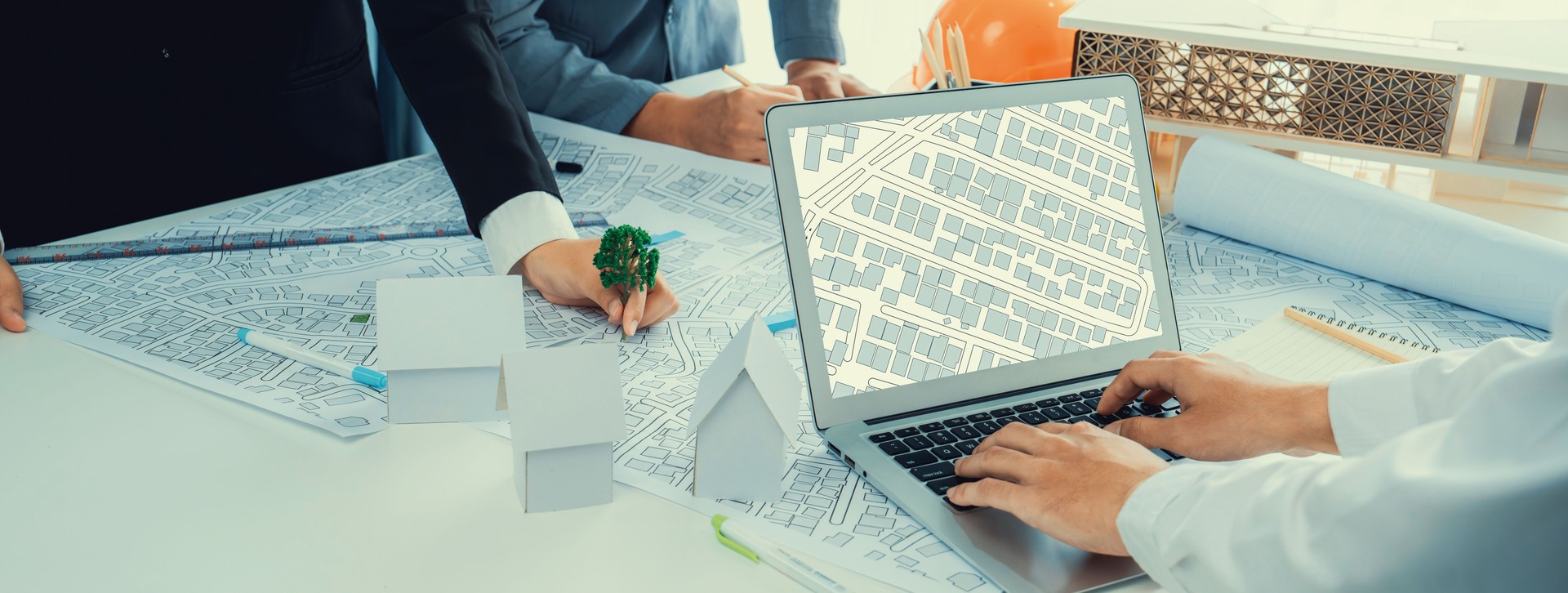 Worker, architect and engineer work on real estate construction project oratory